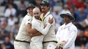 Australia's Nathan Lyon, centre, celebrates with Australia's Pat Cummins, left, and Australia's Mitchell Starc, right.(AP) Australia's Nathan Lyon, centre, celebrates with Australia's Pat Cummins, left, and Australia's Mitchell Starc, right.(AP)