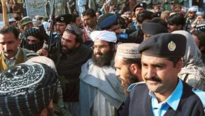 In this Jan. 27, 2000 file photo, Masood Azhar, center, (wearing glasses and white turban), leader of Jaish-e-Mohammad arrives in Islamabad, Pakistan.(Photo: AP) In this Jan. 27, 2000 file photo, Masood Azhar, center, (wearing glasses and white turban), leader of Jaish-e-Mohammad arrives in Islamabad, Pakistan.(Photo: AP)