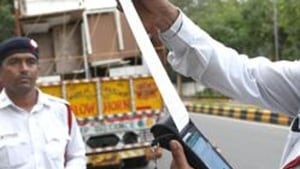 Bikaner’s Harman Ram Bhambhu, owner of a truck (No. RJ07GD0237), was fined for overloading and violation of registration certificate and permit rules.(HT image) Bikaner’s Harman Ram Bhambhu, owner of a truck (No. RJ07GD0237), was fined for overloading and violation of registration certificate and permit rules.(HT image)