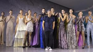 Designer Naeem Khan takes a bow after his collection was modeled during Fashion Week, Tuesday, Sept. 10, 2019, in New York. (AP Photo/Mary Altaffer)(AP) Designer Naeem Khan takes a bow after his collection was modeled during Fashion Week, Tuesday, Sept. 10, 2019, in New York. (AP Photo/Mary Altaffer)(AP)