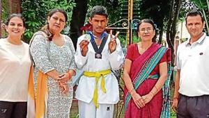 Krishan Kumar, a student of Class 7, won a silver medal in the under-14, below 57kg weight category.(HT) Krishan Kumar, a student of Class 7, won a silver medal in the under-14, below 57kg weight category.(HT)