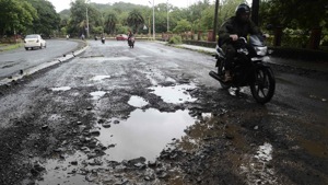 Most potholes re-appeared just before the festive season, when heavy rain lashed the city.(HT image) Most potholes re-appeared just before the festive season, when heavy rain lashed the city.(HT image)