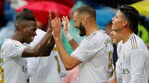 Real Madrid's Karim Benzema celebrates scoring their second goal with Vinicius Junior and James Rodriguez.(REUTERS) Real Madrid's Karim Benzema celebrates scoring their second goal with Vinicius Junior and James Rodriguez.(REUTERS)