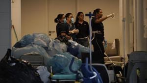 Hospital employees work next to medical equipments at the Badim Hospital, where a fire left at least 11 people dead, in Rio de Janeiro, Brazil on Friday. The fire raced through the hospital forcing staff to wheel patients into the streets on beds or in wheelchairs.(AP Photo) Hospital employees work next to medical equipments at the Badim Hospital, where a fire left at least 11 people dead, in Rio de Janeiro, Brazil on Friday. The fire raced through the hospital forcing staff to wheel patients into the streets on beds or in wheelchairs.(AP Photo)