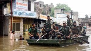 Kota: Army personnel carry out rescue operation in a flood affected area in Kota, Rajasthan.(PTI) Kota: Army personnel carry out rescue operation in a flood affected area in Kota, Rajasthan.(PTI)
