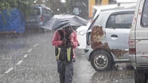 People deal with rain at Marol in Mumbai, India(Satyabrata Tripathy/HT Photo) People deal with rain at Marol in Mumbai, India(Satyabrata Tripathy/HT Photo)