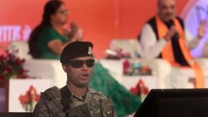 A security guard on duty as BJP National president Amit Shah interacts with youngsters.(File photo: Himanshu Vyas/ Hindustan Times)