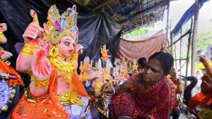 Nagoan: An artist gives final touches to an idol of Lord Vishwakarma at a workshop ahead of upcoming Vishwakarma Puja Festival in Nagaon district of Assam, Saturday, Sept. 14, 2019.(PTI) Nagoan: An artist gives final touches to an idol of Lord Vishwakarma at a workshop ahead of upcoming Vishwakarma Puja Festival in Nagaon district of Assam, Saturday, Sept. 14, 2019.(PTI)
