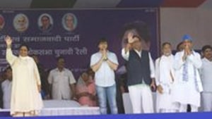 Akash, with folded hands, standing next to BSP leader Satish Mishra. Akash, with folded hands, standing next to BSP leader Satish Mishra.