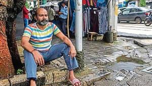 Uday Konar sits at his hawking space in Colaba. His father used to run a newspaper stall at the spot since 1960s(Pratik Chorge/HT Photo) Uday Konar sits at his hawking space in Colaba. His father used to run a newspaper stall at the spot since 1960s(Pratik Chorge/HT Photo)