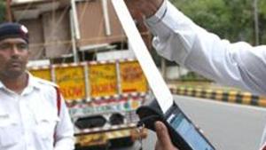 New Delhi, India - September 1, 2019: Delhi Traffic Police personnel issue a fine to a truck driver after the implementation of the amended Motor Vehicles Act that came into force today, near KG Marg in New Delhi, India, on Sunday, September 1, 2019. (Photo by Arvind Yadav/ Hindustan Times)(Arvind Yadav/HT PHOTO) New Delhi, India - September 1, 2019: Delhi Traffic Police personnel issue a fine to a truck driver after the implementation of the amended Motor Vehicles Act that came into force today, near KG Marg in New Delhi, India, on Sunday, September 1, 2019. (Photo by Arvind Yadav/ Hindustan Times)(Arvind Yadav/HT PHOTO)