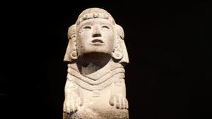 A stone kneeling figure of the Aztec water goddess Chalchiuhtlicue, one of pre-Columbian artefacts, is presented to the press at Drouot auction house in Paris.(REUTERS) A stone kneeling figure of the Aztec water goddess Chalchiuhtlicue, one of pre-Columbian artefacts, is presented to the press at Drouot auction house in Paris.(REUTERS)