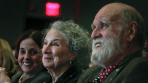 In this March 16, 2017 file photo, author Margaret Atwood, center, appears with her editor Nan Talese, left, and partner Graeme Gibson in New York.(AP) In this March 16, 2017 file photo, author Margaret Atwood, center, appears with her editor Nan Talese, left, and partner Graeme Gibson in New York.(AP)