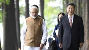 Prime Minister Narendra Modi and Chinese President Xi Jinping walk together in Wuhan in central China's Hubei Province during the April 2018 bilateral.(AP Photo/File) Prime Minister Narendra Modi and Chinese President Xi Jinping walk together in Wuhan in central China's Hubei Province during the April 2018 bilateral.(AP Photo/File)