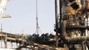 Workers repair a damaged refining tower at Saudi Aramco's Abqaiq crude oil processing plant following a drone attack in Abqaiq, Saudi Arabia, on Friday.(Bloomberg Photo) Workers repair a damaged refining tower at Saudi Aramco's Abqaiq crude oil processing plant following a drone attack in Abqaiq, Saudi Arabia, on Friday.(Bloomberg Photo)
