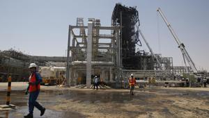In this photo opportunity during a trip organized by Saudi information ministry, a worker walks in front of the Khurais oil field in Khurais, Saudi Arabia.(Photo: AP) In this photo opportunity during a trip organized by Saudi information ministry, a worker walks in front of the Khurais oil field in Khurais, Saudi Arabia.(Photo: AP)