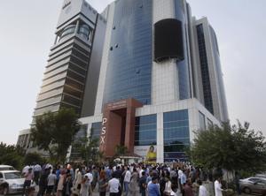 People gather outside their office building after an earthquake in Islamabad, Pakistan on Tuesday.(AP Photo) People gather outside their office building after an earthquake in Islamabad, Pakistan on Tuesday.(AP Photo)