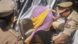 The woman law student (face covered), who alleged BJP leader Chinmayanand of sexual misconduct and harassment, arrested by the Special Investigation Team (SIT) a day after she was detained for questioning in an extortion case, in Shahjahanpur, Wednesday, Sept. 25, 2019.(PTI) The woman law student (face covered), who alleged BJP leader Chinmayanand of sexual misconduct and harassment, arrested by the Special Investigation Team (SIT) a day after she was detained for questioning in an extortion case, in Shahjahanpur, Wednesday, Sept. 25, 2019.(PTI)