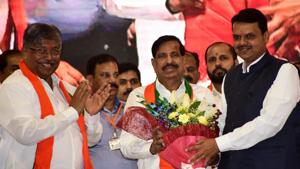 Maharashtra CM Devendra Fadnavis inductes Navi Mumbai NCP strongman Ganesh Naik along with its 54 Corporators from Navi Mumbai Municipal Corporation (NMMC) into BJP during an event held at CIDCO Exhibition Center Vashi in Navi Mumbai.(Photo: Bachchan Kumar/ Hindustan Times) Maharashtra CM Devendra Fadnavis inductes Navi Mumbai NCP strongman Ganesh Naik along with its 54 Corporators from Navi Mumbai Municipal Corporation (NMMC) into BJP during an event held at CIDCO Exhibition Center Vashi in Navi Mumbai.(Photo: Bachchan Kumar/ Hindustan Times)