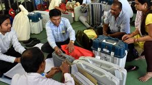 File photo of election officials with EVMs. (ANI Photo)