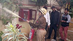 A woman firefighter at work in Jaipur.(HT Photo) A woman firefighter at work in Jaipur.(HT Photo)