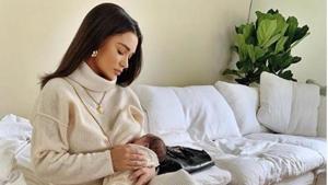 Amy Jackson feeds her baby. Amy Jackson feeds her baby.