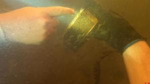 Michael Bennett was diving into the Edisto River in South Carolina when he found the iPhone.(YouTube/nuggetnoggin) Michael Bennett was diving into the Edisto River in South Carolina when he found the iPhone.(YouTube/nuggetnoggin)
