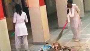 Videos of school girls sweeping the floor of the school premises, were shared multiple times on WhatsApp on Monday.(HT Photo) Videos of school girls sweeping the floor of the school premises, were shared multiple times on WhatsApp on Monday.(HT Photo)
