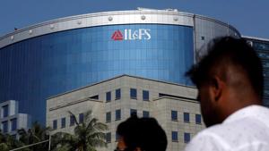 People walk past a building of IL&FS (Infrastructure Leasing and Financial Services Ltd.) outside its headquarters in Mumbai, India, September 25, 2018.(REUTERS) People walk past a building of IL&FS (Infrastructure Leasing and Financial Services Ltd.) outside its headquarters in Mumbai, India, September 25, 2018.(REUTERS)