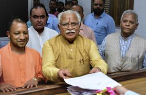 Haryana chief minister Manohar Lal Khattar files nominations from Karnal assembly seat at the SDM’s Office, in Karnal onTuesday in the presence of UP chief minister Yogi Adityanath and Union minister Rattan Lal Kataria.(PTI Photo) Haryana chief minister Manohar Lal Khattar files nominations from Karnal assembly seat at the SDM’s Office, in Karnal onTuesday in the presence of UP chief minister Yogi Adityanath and Union minister Rattan Lal Kataria.(PTI Photo)