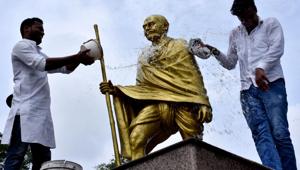 Congress Youth workers clean statue of Mahatma Gandhi on the eve of his 150th birth anniversary, in Prayagraj on Tuesday.(ANI) Congress Youth workers clean statue of Mahatma Gandhi on the eve of his 150th birth anniversary, in Prayagraj on Tuesday.(ANI)