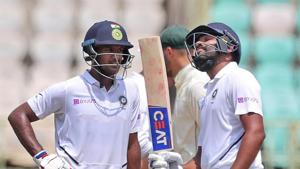 India's Rohit Sharma, right, celebrates after scoring fifty runs with Mayank Agarwal, left, during the first day of the first cricket test match against South Africa in Visakhapatnam, India, Wednesday, Oct. 2, 2019.(AP) India's Rohit Sharma, right, celebrates after scoring fifty runs with Mayank Agarwal, left, during the first day of the first cricket test match against South Africa in Visakhapatnam, India, Wednesday, Oct. 2, 2019.(AP)