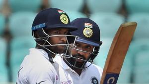 India's Mayank Agarwal raises his bat after scoring a century and Rohit Sharma looks on in the first Test(PTI) India's Mayank Agarwal raises his bat after scoring a century and Rohit Sharma looks on in the first Test(PTI)