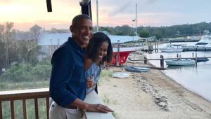 Michelle Obama posted a heartwarming message with a photo of the couple smiling and overlooking a beach.(Instagram/Michelle Obama) Michelle Obama posted a heartwarming message with a photo of the couple smiling and overlooking a beach.(Instagram/Michelle Obama)