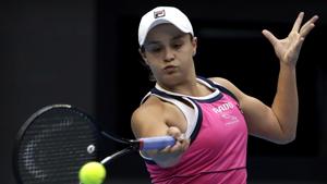 Ashleigh Barty of Australia hits a return shot.(AP) Ashleigh Barty of Australia hits a return shot.(AP)