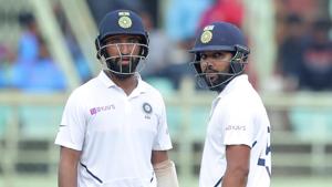 India's Rohit Sharma, right, and Cheteshwar Pujara stand in the field during the fourth day of the first Test.(AP) India's Rohit Sharma, right, and Cheteshwar Pujara stand in the field during the fourth day of the first Test.(AP)