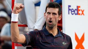 Novak Djokovic of Serbia celebrates winning his match.(REUTERS)