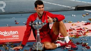 Novak Djokovic of Serbia celebrates with the trophy after winning.(REUTERS)