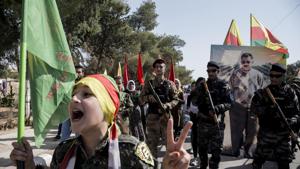 Fighters of the Syrian Democratic Forces, SDF, march during a demonstration against possible Turkish military operation in their areas in Al-Qahtaniya, Syria.(AP Photo)