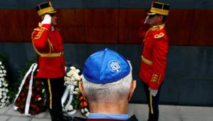 A member of Romania's Jewish community lays a wreath during ceremonies at a Holocaust memorial in Bucharest.(REUTERS) A member of Romania's Jewish community lays a wreath during ceremonies at a Holocaust memorial in Bucharest.(REUTERS)
