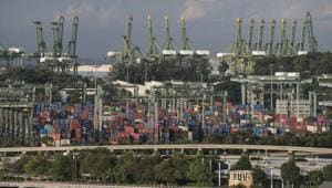 Stacked containers sit among gantry cranes at the Port of Singapore in Singapore in July 12, 2019. In its latest assessment of the factors behind productivity and long-term economic growth, the organization best-known for its annual gathering of the elites in the Swiss ski resort of Davos found Singapore overtaking the United States as the most competitive country.(Representative Image/Bloomberg File Photo) Stacked containers sit among gantry cranes at the Port of Singapore in Singapore in July 12, 2019. In its latest assessment of the factors behind productivity and long-term economic growth, the organization best-known for its annual gathering of the elites in the Swiss ski resort of Davos found Singapore overtaking the United States as the most competitive country.(Representative Image/Bloomberg File Photo)