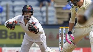 India's wicket-keeper Wriddhiman Saha dives to take a catch.(PTI) India's wicket-keeper Wriddhiman Saha dives to take a catch.(PTI)
