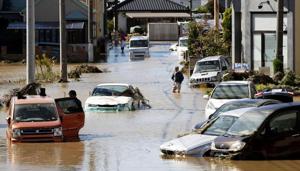 Well before making landfall, the outer bands of the storm claimed their first victim, a driver whose van was flipped over in the strong gusts.(AP Photo) Well before making landfall, the outer bands of the storm claimed their first victim, a driver whose van was flipped over in the strong gusts.(AP Photo)