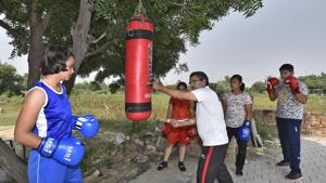 Rohtak, India - Oct. 13, 2019: Manju Rani’s coach Saheb Singh Narwal is seen with young boxers at a practice area, in Rohtak, Haryana, India, on Sunday, October 13, 2019. Manju Rani settled for a silver medal after going down against Russia’s Ekaterina Paltceva via 4:1 verdict in the 48kg summit clash at World Boxing Championships in Russia(Burhaan Kinu/HT PHOTO) Rohtak, India - Oct. 13, 2019: Manju Rani’s coach Saheb Singh Narwal is seen with young boxers at a practice area, in Rohtak, Haryana, India, on Sunday, October 13, 2019. Manju Rani settled for a silver medal after going down against Russia’s Ekaterina Paltceva via 4:1 verdict in the 48kg summit clash at World Boxing Championships in Russia(Burhaan Kinu/HT PHOTO)