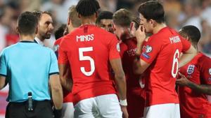 England players speak with manager Gareth Southgate as the match is temporarily stopped.(Reuters) England players speak with manager Gareth Southgate as the match is temporarily stopped.(Reuters)