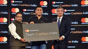 Indian cricketer Mahendra Singh Dhoni with Co-President for Asia Pacific launch the 'Team Cashless India', a nationwide initiative to accelerate and adoption of digital payment.(PTI Photo) Indian cricketer Mahendra Singh Dhoni with Co-President for Asia Pacific launch the 'Team Cashless India', a nationwide initiative to accelerate and adoption of digital payment.(PTI Photo)