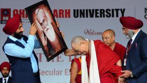 Chandigarh University chancellor Satnam Singh Sandhu welcoming The Dalai Lama at the university, Gharuan campus, in Punjab on Tuesday.(Keshav Singh/HT) Chandigarh University chancellor Satnam Singh Sandhu welcoming The Dalai Lama at the university, Gharuan campus, in Punjab on Tuesday.(Keshav Singh/HT)
