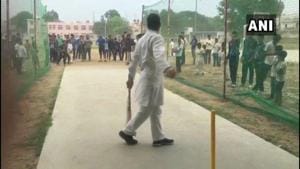 Rahul Gandhi seen playing cricket with boys in Rewari after his chopper made an emergency landing at a college ground due to bad weather.(ANI Photo) Rahul Gandhi seen playing cricket with boys in Rewari after his chopper made an emergency landing at a college ground due to bad weather.(ANI Photo)