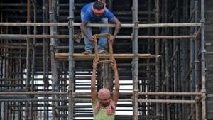 Labourers work at the construction site of a residential building on the outskirts of Kolkata, India.(Photo: Reuters) Labourers work at the construction site of a residential building on the outskirts of Kolkata, India.(Photo: Reuters)