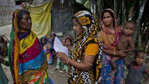 A woman checks for names in the final list of the National Register of Citizens (NRC) on a printed sheet of paper in Pabhokati village in Morigaon district, Assam.(AP File) A woman checks for names in the final list of the National Register of Citizens (NRC) on a printed sheet of paper in Pabhokati village in Morigaon district, Assam.(AP File)